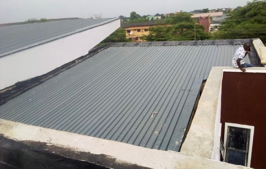 Modern lecture hall building with metal roofing